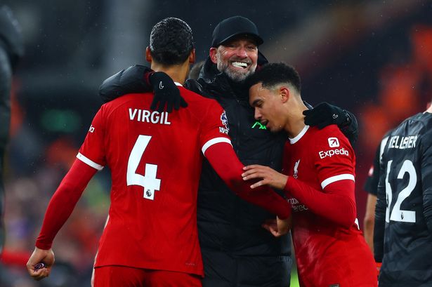 Liverpool manager Jürgen Klopp celebrates with Virgil van Djik and Trent Alexander-Arnold at full-time following the Premier League win over Fulham.