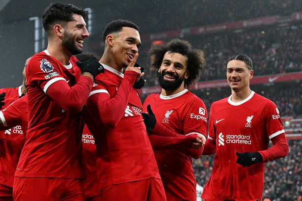 Trent Alexander-Arnold of Liverpool celebrates after scoring the opening goal during the Premier League match between Liverpool FC and Fulham FC at Anfield on December 03, 2023 in Liverpool, England.